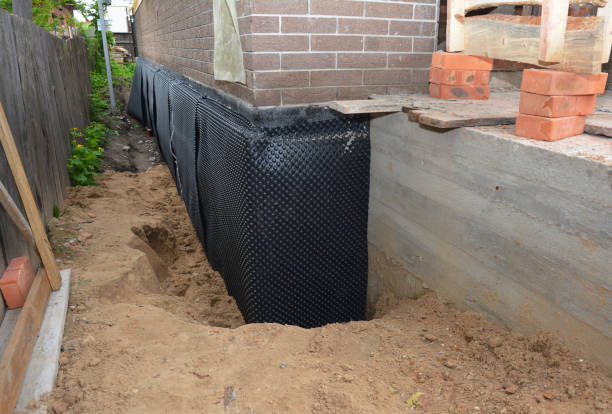 Happy homeowners after waterproofing job in Kingsville